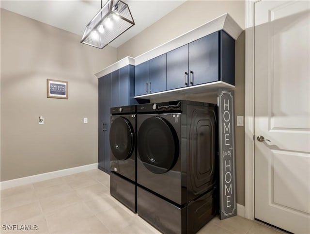 laundry room with cabinets and washing machine and dryer