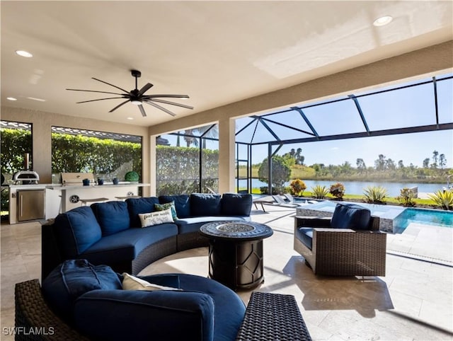 view of patio / terrace with area for grilling, outdoor lounge area, ceiling fan, a water view, and glass enclosure