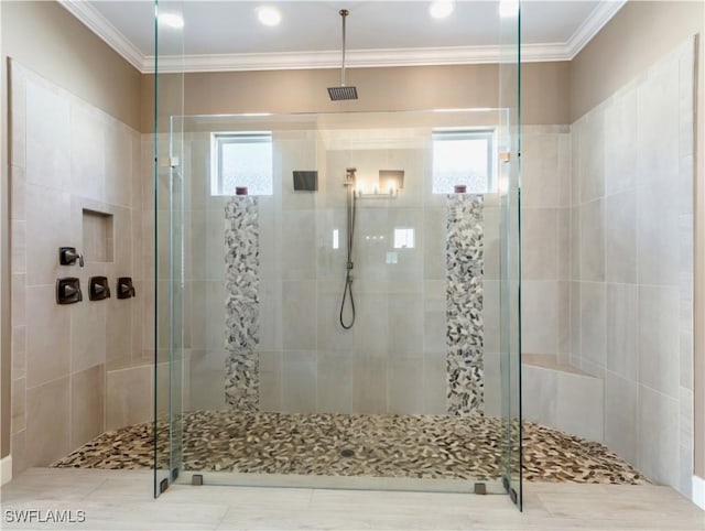 bathroom with walk in shower and ornamental molding