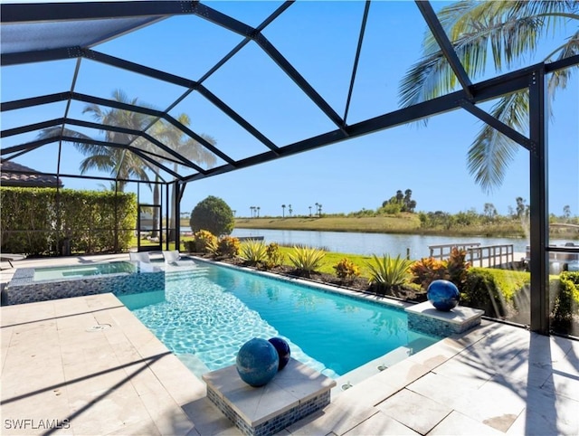 view of swimming pool featuring glass enclosure, an in ground hot tub, a patio area, and a water view