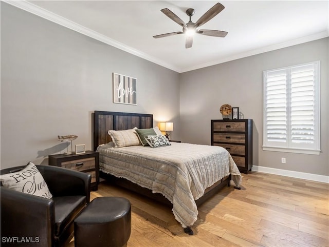 bedroom with light hardwood / wood-style flooring, ceiling fan, and ornamental molding