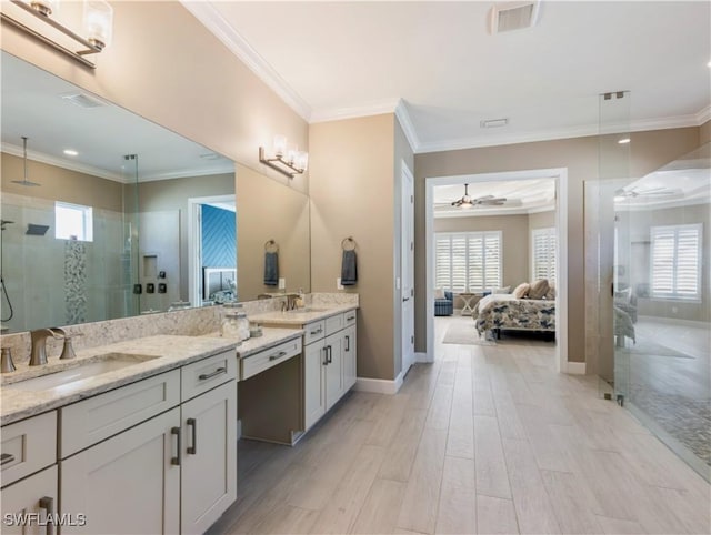 bathroom featuring an enclosed shower, vanity, ceiling fan, crown molding, and hardwood / wood-style floors