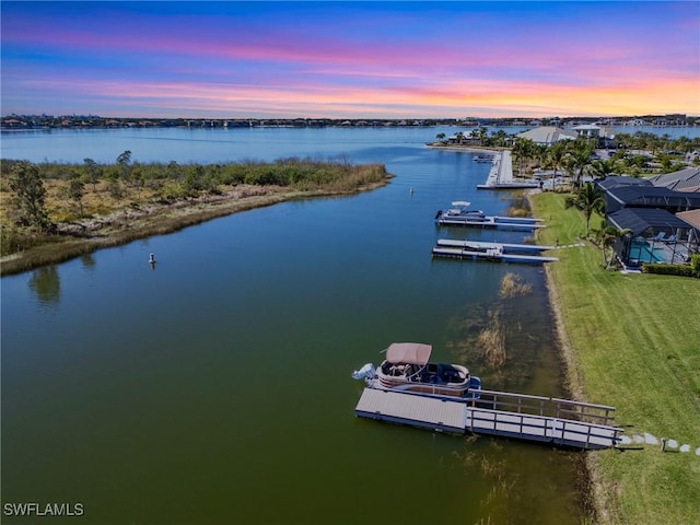 aerial view at dusk with a water view