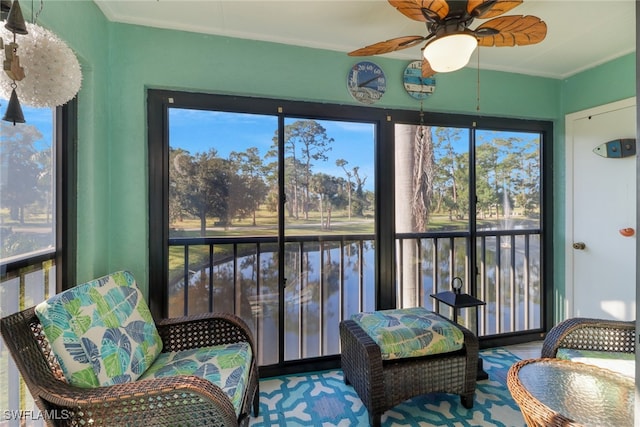 sunroom / solarium with ceiling fan and a healthy amount of sunlight