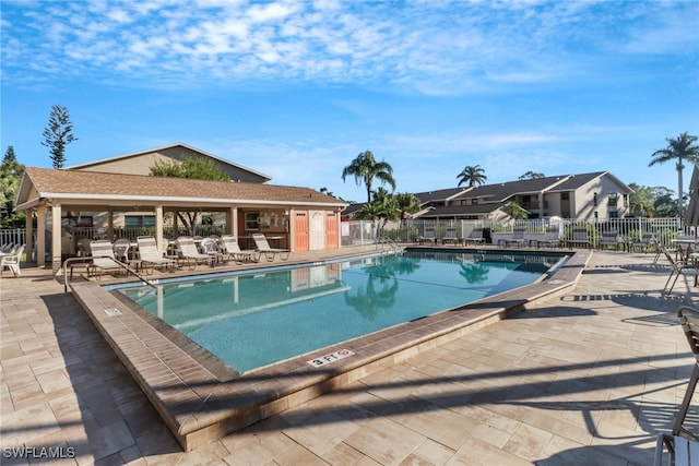 view of swimming pool with a patio area