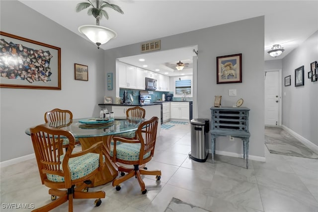 dining room with ceiling fan