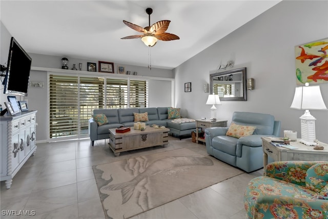 living room with ceiling fan and vaulted ceiling