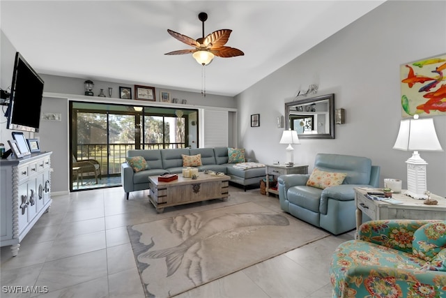 living room with ceiling fan, light tile patterned floors, and vaulted ceiling