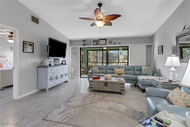 living room with ceiling fan, a healthy amount of sunlight, and lofted ceiling