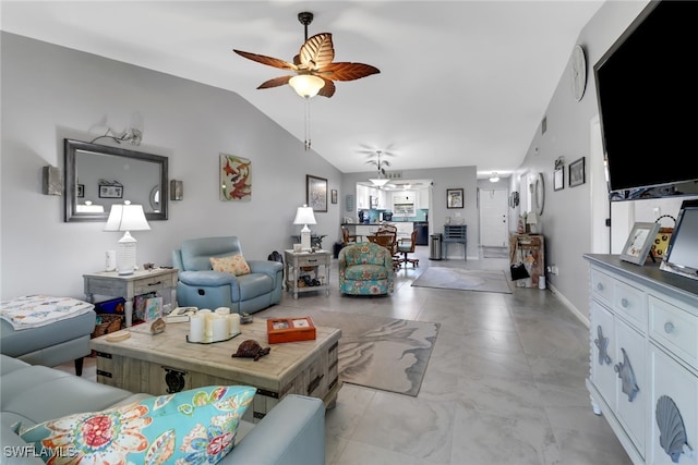 living room with ceiling fan and vaulted ceiling