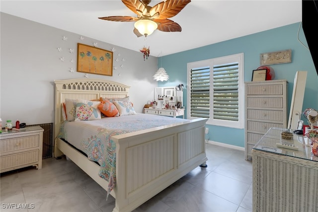 tiled bedroom featuring ceiling fan