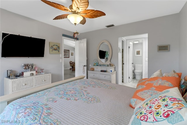 bedroom featuring ensuite bath and ceiling fan