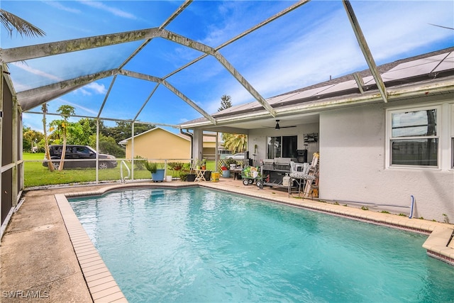 view of pool featuring ceiling fan