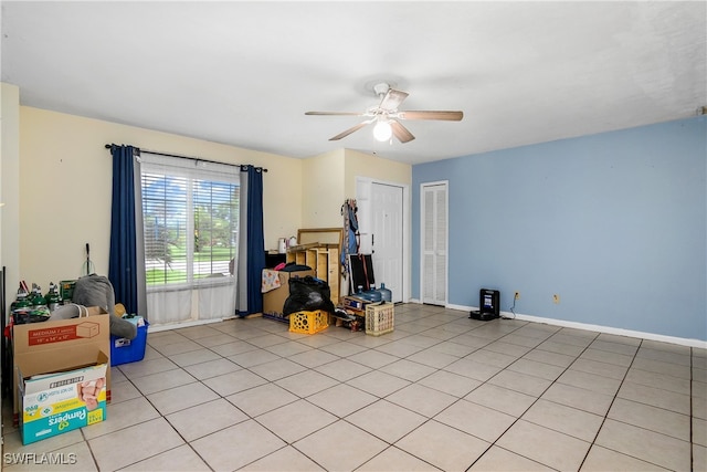 miscellaneous room featuring ceiling fan and light tile patterned flooring