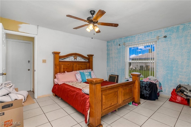 bedroom with ceiling fan and light tile patterned floors