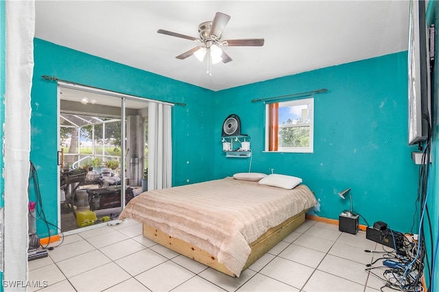 tiled bedroom with multiple windows and ceiling fan