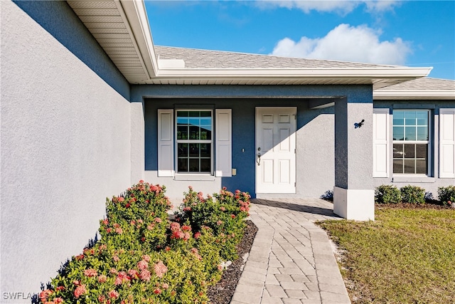 entrance to property with a yard