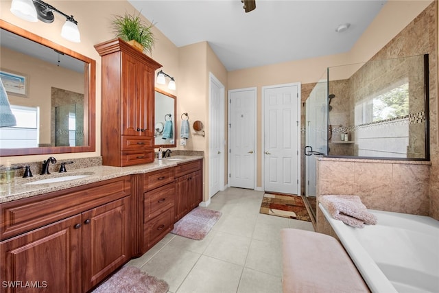 bathroom with vanity, tile patterned floors, and walk in shower