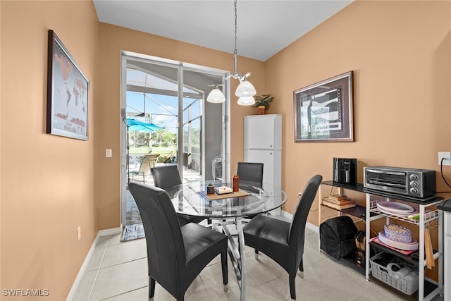 dining area featuring light tile patterned floors