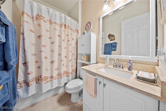 bathroom with tile patterned floors, toilet, and vanity