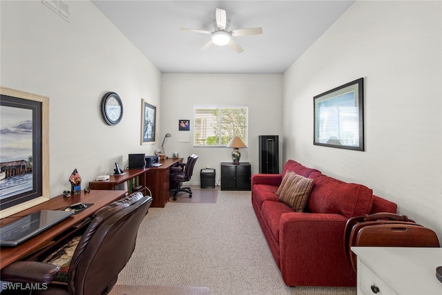 office featuring light carpet and ceiling fan