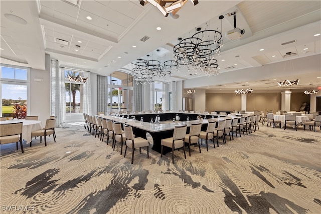 dining area with carpet flooring and a high ceiling