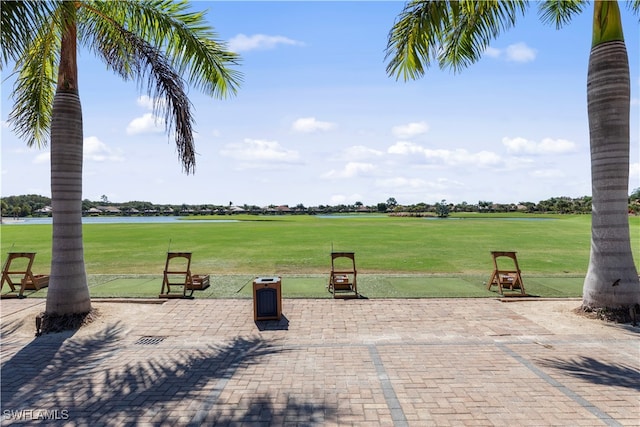 view of patio with a water view