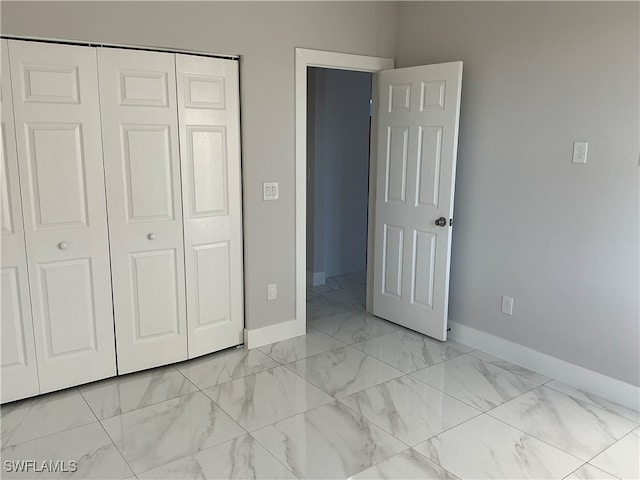 unfurnished bedroom with a closet