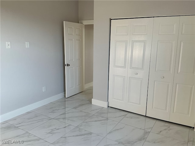 unfurnished bedroom featuring a closet