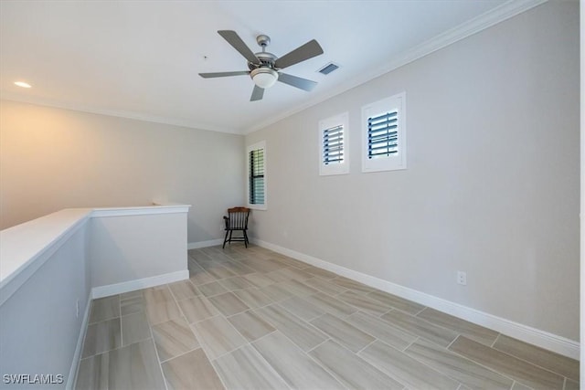 unfurnished room featuring ceiling fan and crown molding