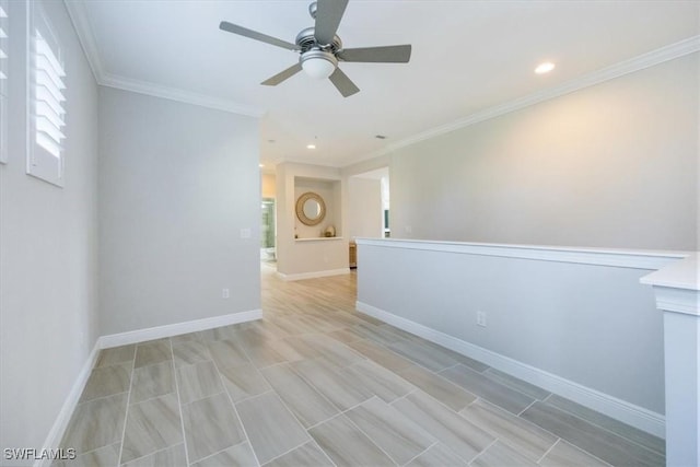 empty room with crown molding and ceiling fan