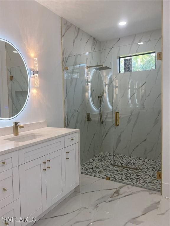 bathroom featuring vanity and an enclosed shower