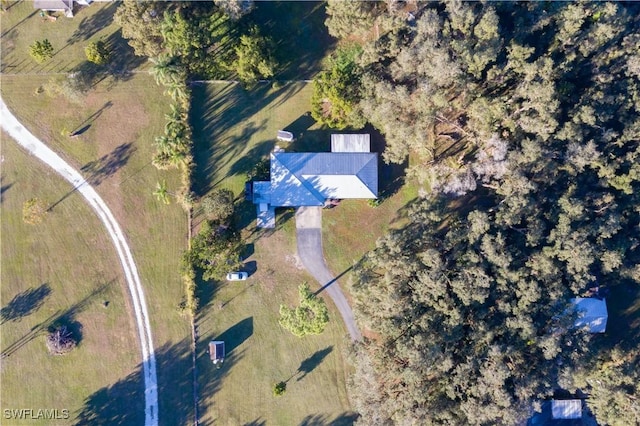 birds eye view of property with a rural view