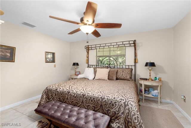 tiled bedroom with ceiling fan