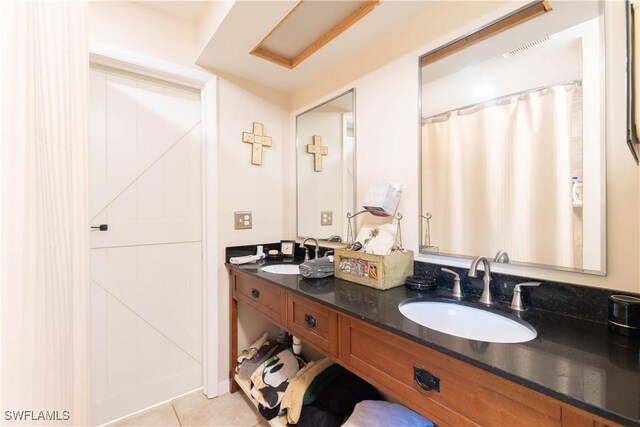 bathroom featuring tile patterned floors and vanity