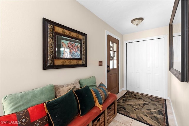 foyer featuring light tile patterned flooring