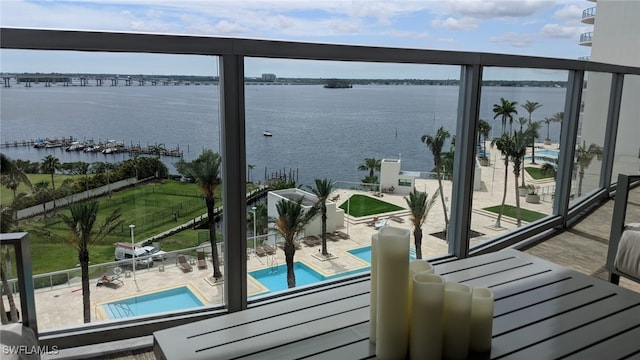 balcony featuring a water view