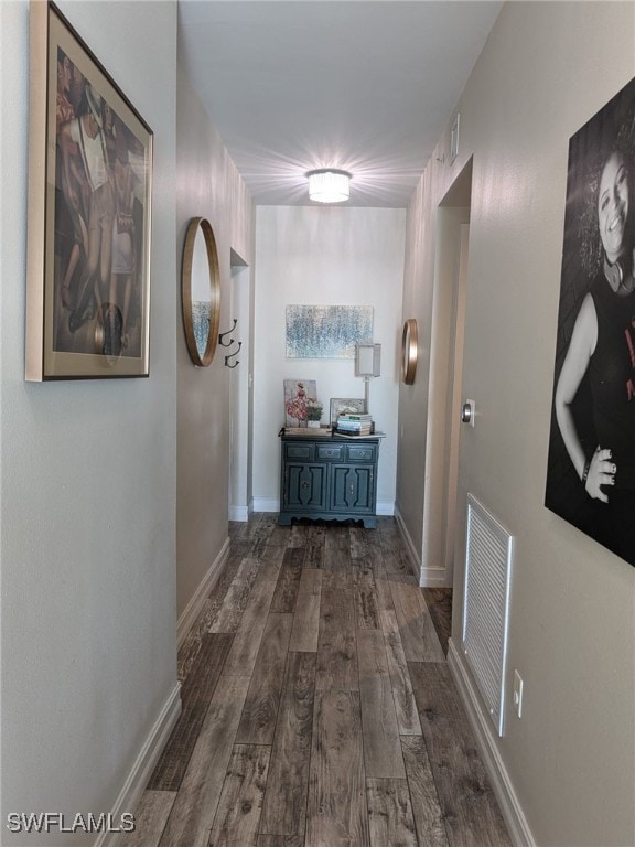 corridor with dark wood-type flooring