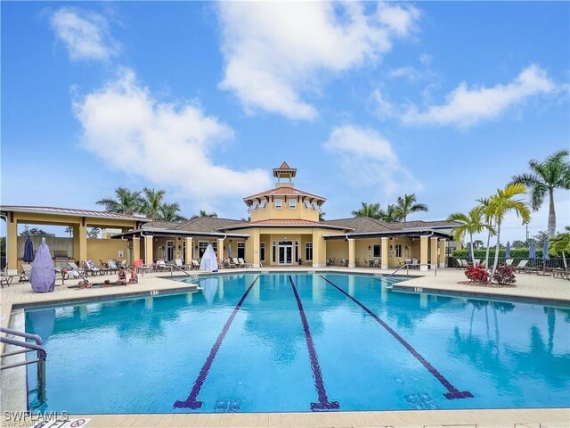 view of swimming pool with a patio