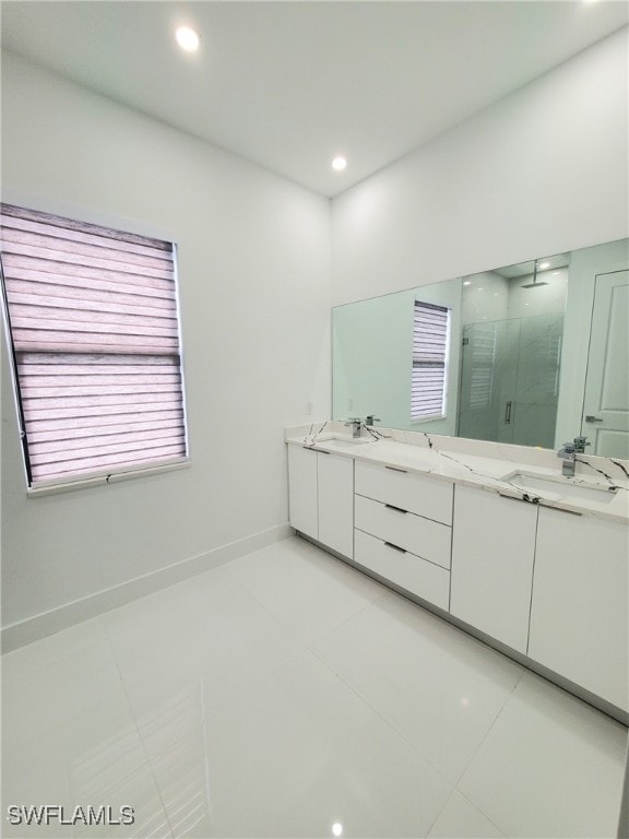 bathroom featuring tile patterned floors, vanity, and an enclosed shower