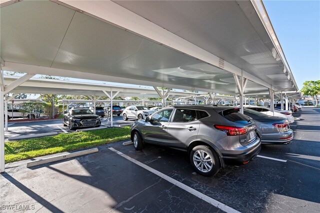 view of parking / parking lot featuring a carport