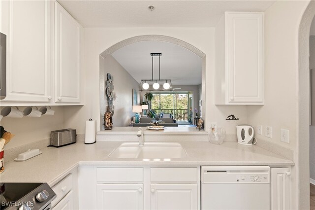 kitchen featuring pendant lighting, white cabinetry, dishwasher, sink, and stove