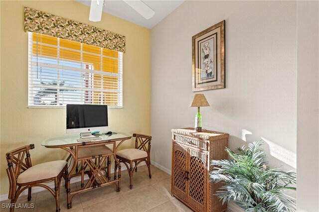 office space with light tile patterned floors and ceiling fan