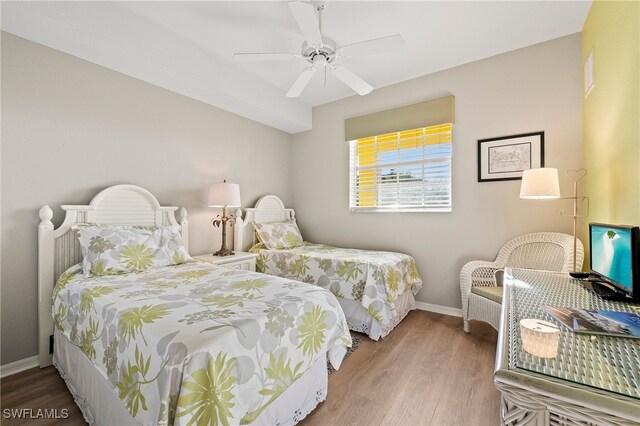 bedroom featuring hardwood / wood-style floors and ceiling fan