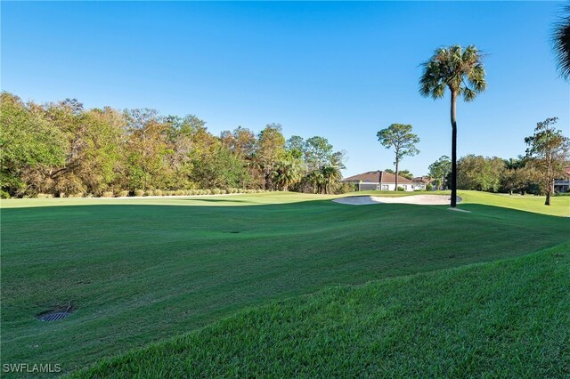 view of home's community featuring a lawn