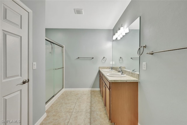 bathroom with vanity, tile patterned floors, and walk in shower