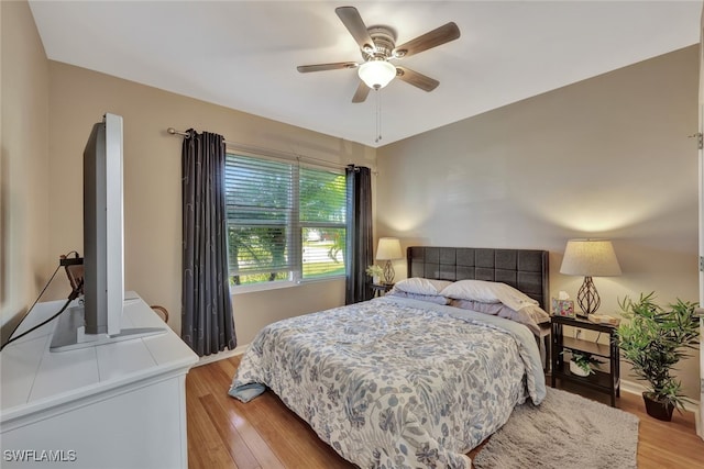 bedroom featuring light hardwood / wood-style floors and ceiling fan