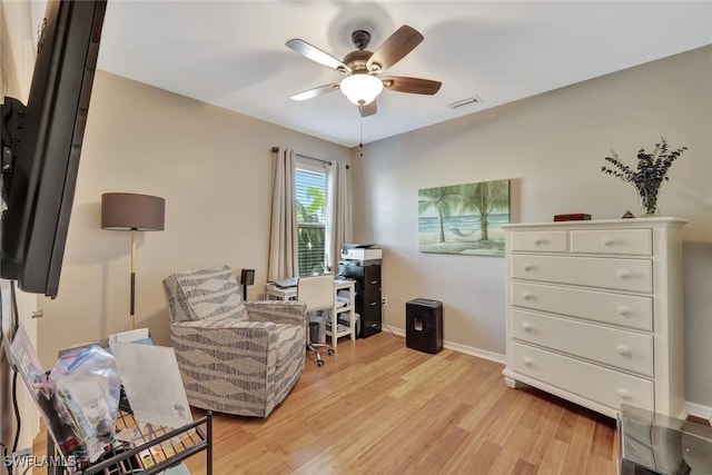 office space with light hardwood / wood-style flooring and ceiling fan