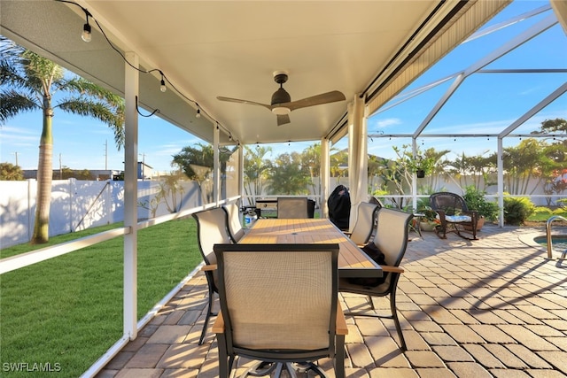 view of patio / terrace with glass enclosure and ceiling fan