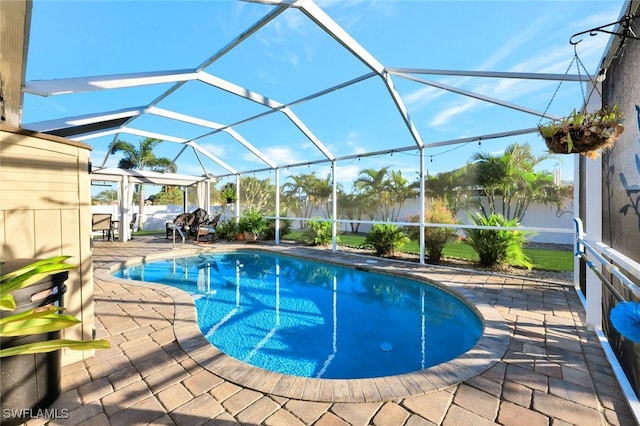 view of pool featuring a lanai and a patio